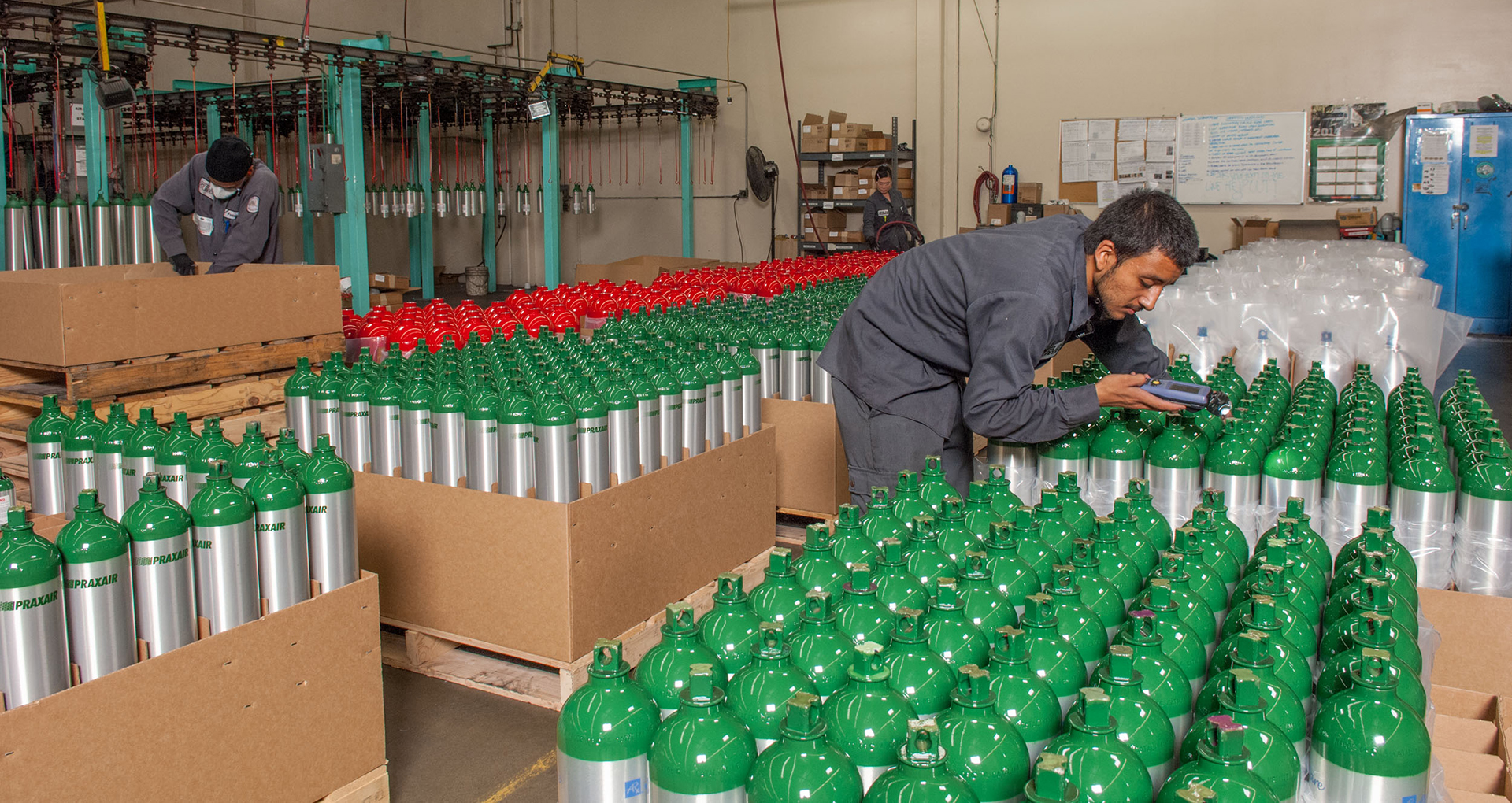 Catalina team inspecting medical cylinders before shipping